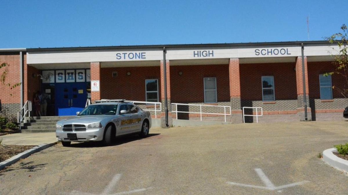 A sheriff’s cruiser is stationed outside Stone High School on Tuesday.