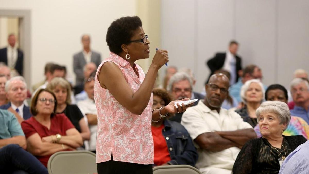 Gulfport Councilwoman Ella Holmes-Hines tells Lt. Gov. Tate Reeves how she would like to see the BP money received for economic damages spent as she addresses a group of a couple hundred interested residents during a town hall meeting Thursday, at the Lyman Community Center.