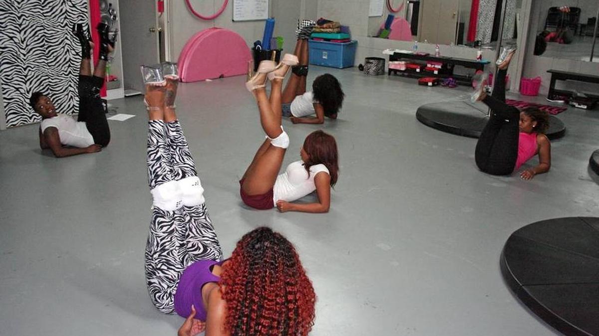 Terneeshia Smart practices floor exercises with her pole fitness students at Aerial Fit Lab in Gulfport, Mississippi. ‘How to twerk?’ was a popular search in Google among Mississippians over the past five years, according to Estately blog.