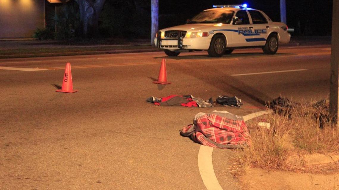 Clothing is scattered across East Pass Road near Ford Street where a pedestrian was struck by a vehicle Monday night. Gulfport police are on the scene.