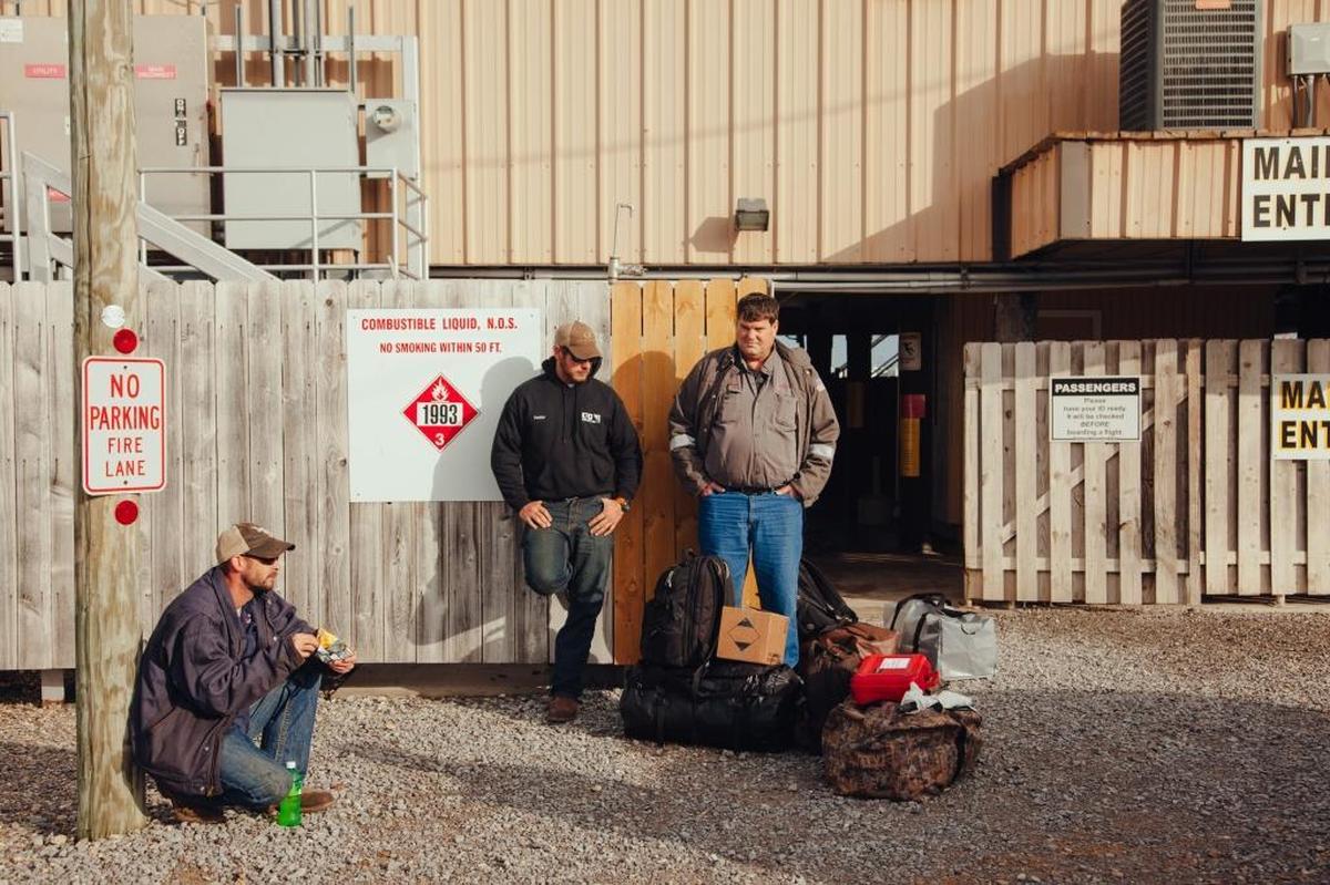 Don LeBoeuf, right, and crew members wait to take a boat to an Energy XXI platform in the Gulf of Mexico, in Port Fourchon, La., Jan. 10, 2018. For offshore crews, the the Trump administration’s changes bring renewed optimism about work. “It affects from the lowest guy to the highest guy, regulations, all day long,” LeBouef said.
