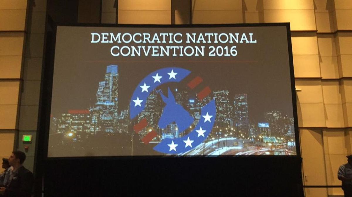 One of the two screens that gave delegates a better view inside the Women's Caucus meeting at the convention center on Wednesday.