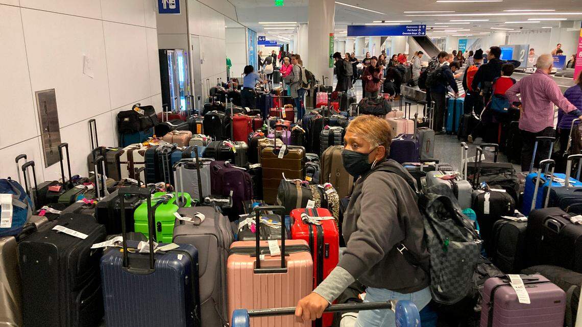 Baggage waits to be claimed after canceled flights at the Southwest Airlines terminal at Los Angeles International Airport on Monday, Dec. 26, 2022, in Los Angeles. (AP Photo/Eugene Garcia)