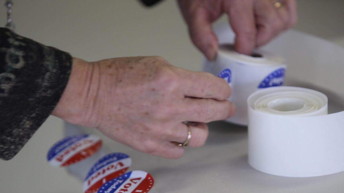 A precinct worker prepares 'I Voted' stickers at Gulfport precinct 5 at Mississippi Gulf Coast Studios on Tuesday Nov. 3, 2015. 