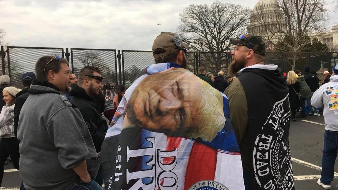 R.J. Tanner of Lucedale, middle, and friends await the inauguration of President Donald Trump on Friday in Washington.