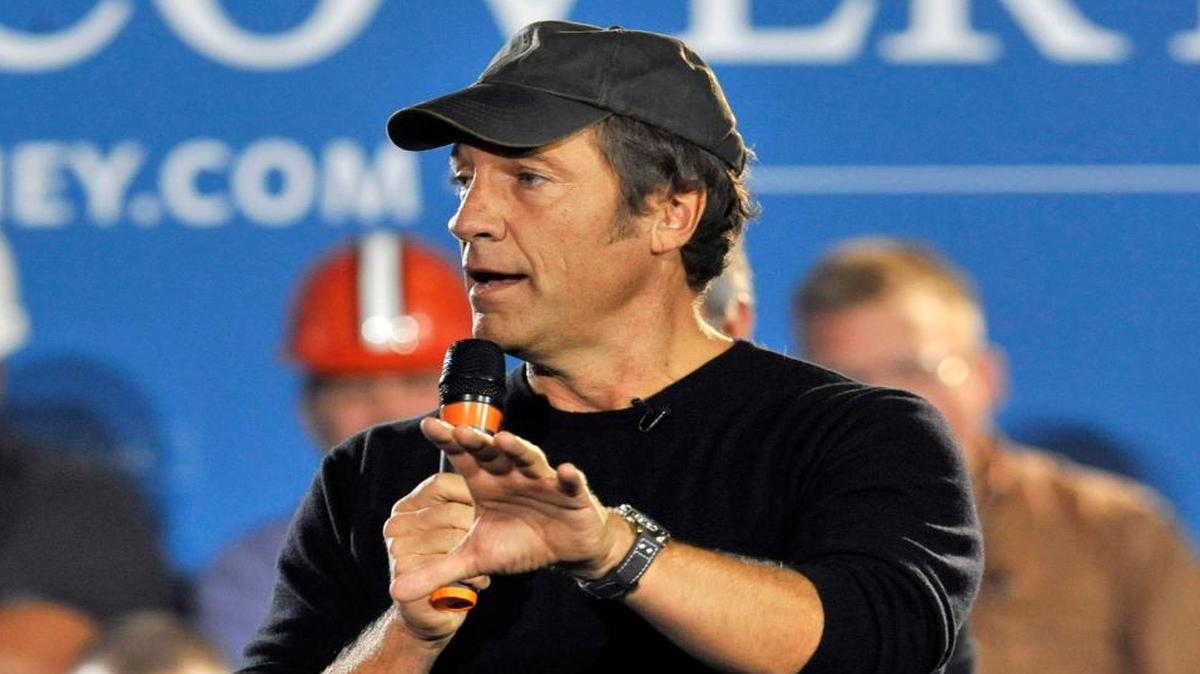 In this Sept. 26, 2012 file photo, Mike Rowe, host of television show "Dirty Jobs," speaks at American Spring Wire in Bedford Heights, Ohio.