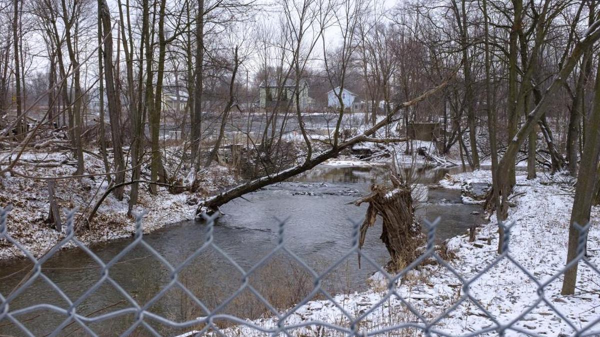 Eighteen Mile Creek flows behind the former Flintkote Plant in Lockport, N.Y. The EPA in late January announced finalized plans for the second phase of their $23 million Superfund project to dredge and cap former residences and manufacturing facilities along the creek.