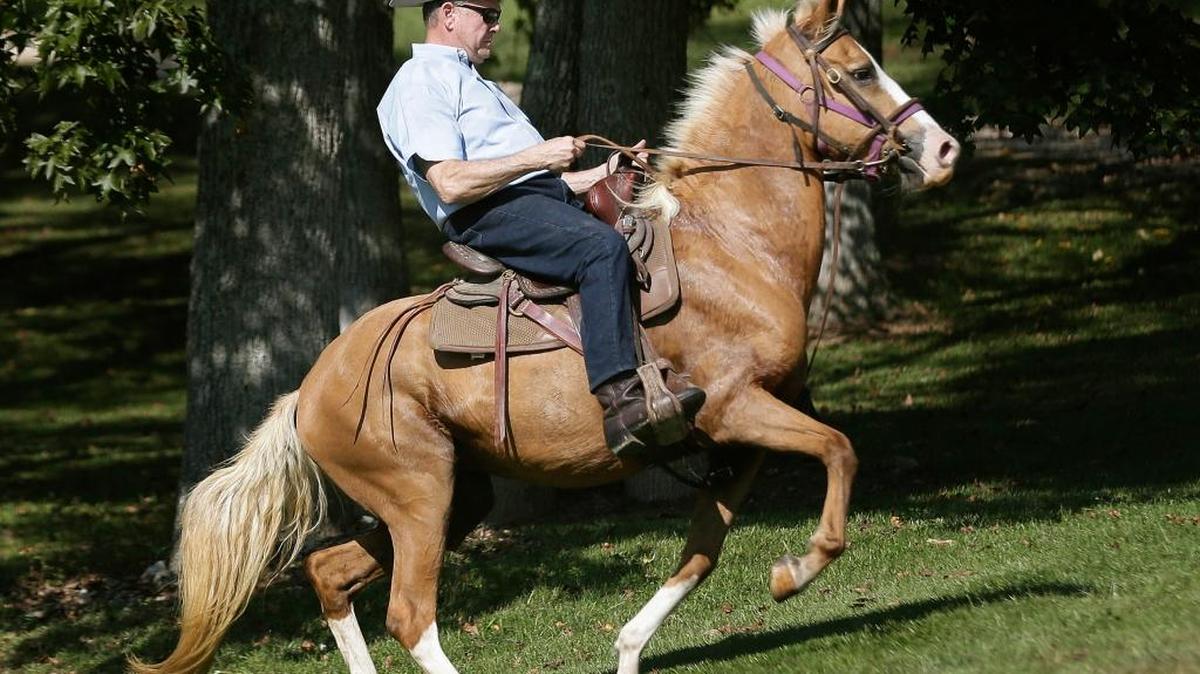 In this Tuesday, Sept. 26, 2017 file photo, former Alabama Chief Justice and U.S. Senate candidate Roy Moore rides in on a horse to vote at the Gallant Volunteer Fire Department during the Alabama Senate race in Gallant, Ala.