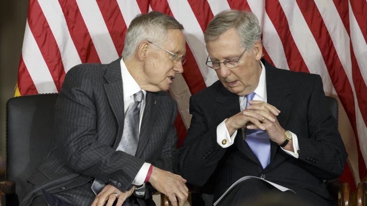Senate Majority Leader Harry Reid of Nev., left, talks with Senate Minority Leader Mitch McConnell of Ky., on Capitol Hill in Washington in 2014.