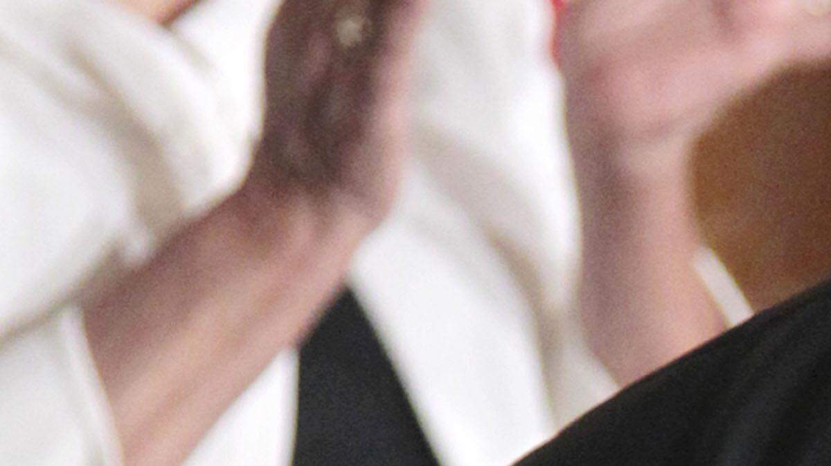 President Barack Obama kisses author and poet Maya Angelou after awarding her the 2010 Medal of Freedom during a ceremony in the East Room of the White House in 2011.