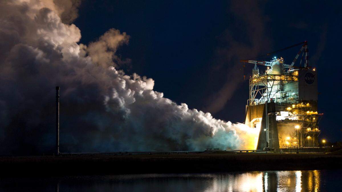 NASA's Stennis Space Center lights up during a hot-fire test of the RS-25 engine and new engine controller unit last year.