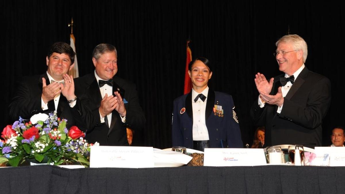 Yes, we’re indefatigable in search of the truth. Here we have Rep. Steven Palazzo, Secretary of the Air Force Michael Donley, and Sen. Roger Wicker, you guessed it, applauding Master Sgt. Nicole Dismute of the Mathies NCO Academy at Keesler Air Force Base, the winner of the Thomas V. Fredian Community Leadership Award during the 34th Annual Salute To The Military Oct. 23, 2012, at the Mississippi Coast Coliseum in Biloxi.