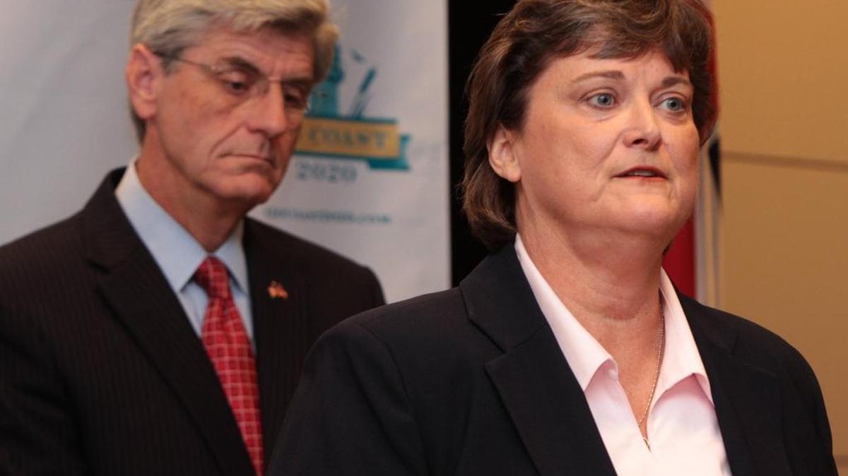 Gov. Phil Bryant listens as Mississippi Department of Environmental Quality director Trudy Fisher speaks at a 2012 press conference announcing the creation of GoCoast 2020.