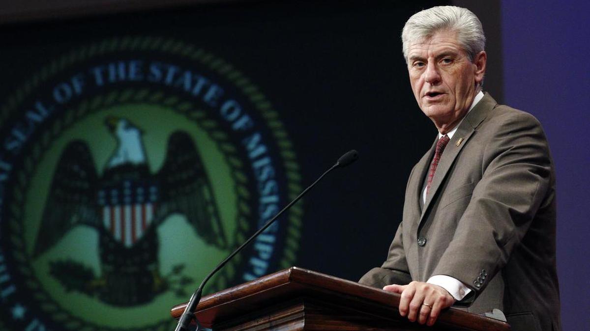 Mississippi Gov. Phil Bryant joins several other statewide elected officials, clergy members and representatives from law enforcement agencies across Mississippi for Blue Prayer Day honoring the men and women in law enforcement, at First Baptist Church in Jackson, Miss., Friday, Aug. 19, 2016.