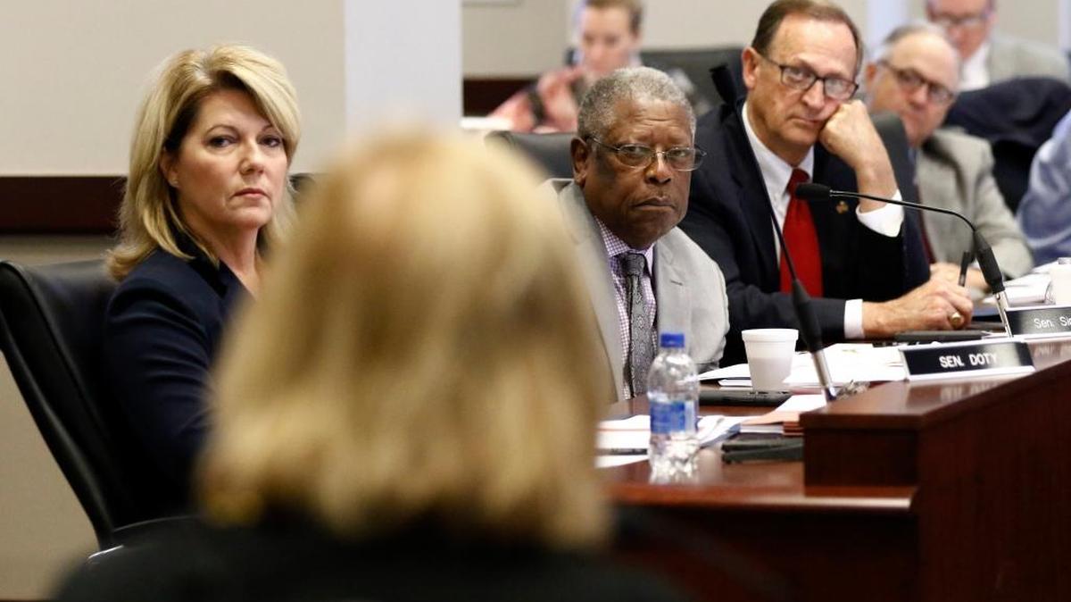Sens. Sally Doty, R-Brookhaven, left, Willie Simmons, D-Cleveland, center and Dean Kirby, R-Pearl, listen to Mississippi Public Employees' Retirement System Executive Director Pat Robertson, foreground, discuss the system's payout system before the Joint Legislative Budget Committee hearing in Jackson, Miss., Friday, Sept. 22, 2017.
