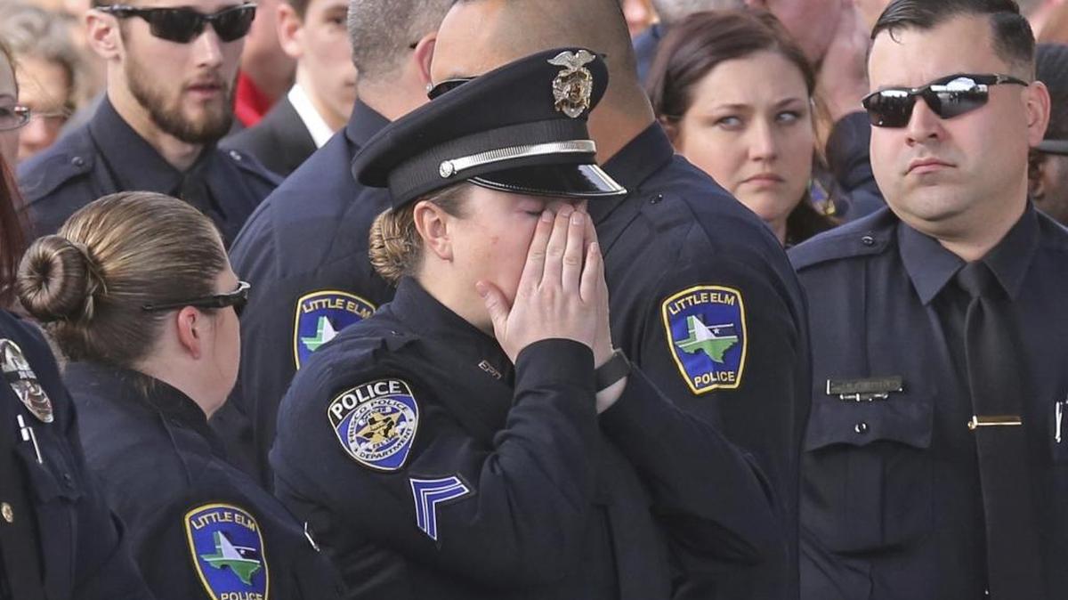 A police officer wipes away tears at the funeral service for a Texas officer recently killed in the line of duty. In Mississippi, the death penalty applies in cases where officers are killed, but Coast Sen. Sean Tindell believes the state’s enhanced hate crime penalties also should apply to other crimes against first responders.