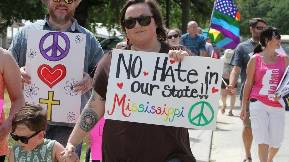 Scott and Schyler Wiecek of Bay St. Louis walk with their son, Remy, 3, during a No Hate in Our State rally in Bay St. Louis on Sunday May 15, 2016. On Thursday, Judge Carlton Reeves declared HB1523, a law many considered a reaction to gay marriage in Mississippi, unconstitutional.