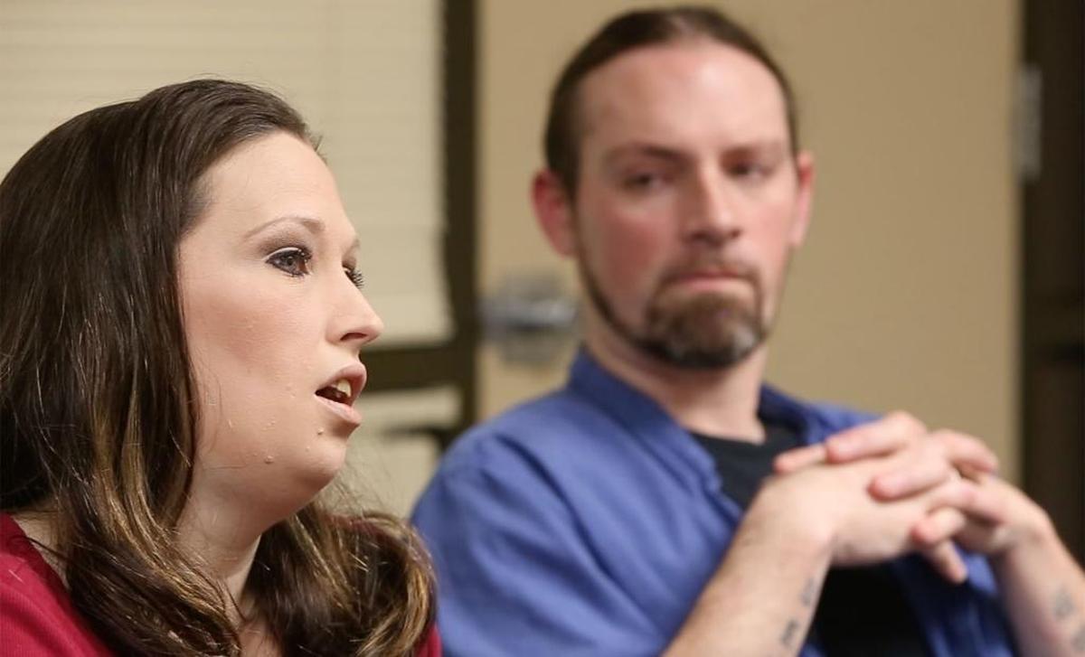 Scott Berry listens as his wife, Jennifer, talks on May 11, 2016, about the day the Hancock County Department of Human Services took their children in March 2014. The case was dismissed four months later as being unfounded.