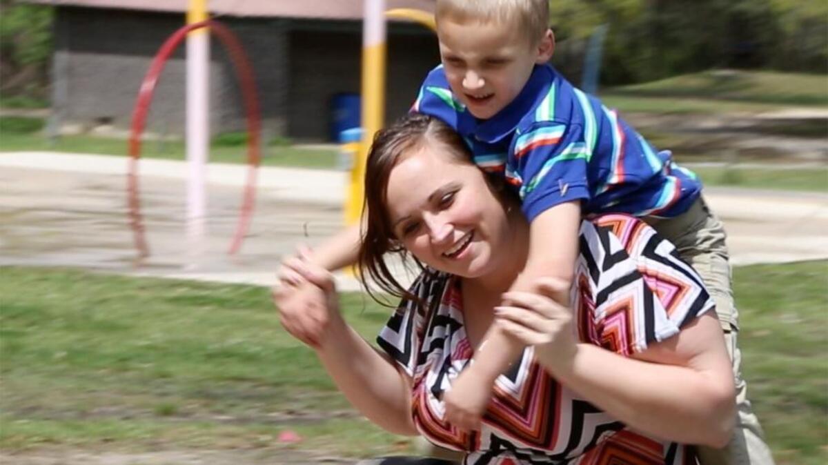 Marie Gill plays with her son, Michael, 5, at McLeod Park in Kiln in March 2016.