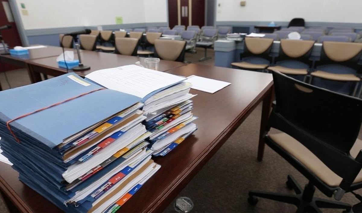 A stack of case files sit in Harrison County Youth Court before their session on May 17, 2016 in Gulfport.
