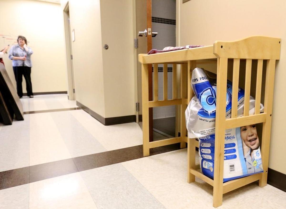 A changing table sits in the hallway of the Hancock County Department of Human Services' Kiln office on Wednesday, March 9, 2016. Caseworkers bring in children at all hours and have to be prepared to care for them until they can be placed with a relative or in a foster home.
