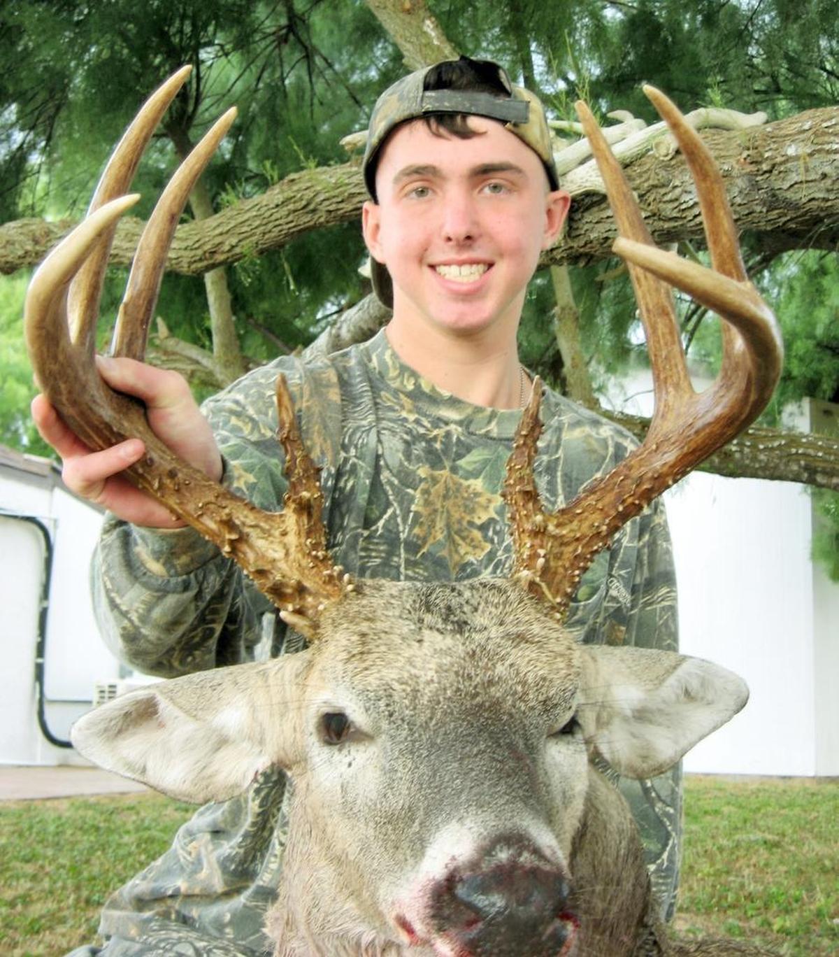 Kaleb Miller of St. Martin holds a deer he harvested after shooting it in Kingsville, Texas, a short time before his death due to a brain tumor.