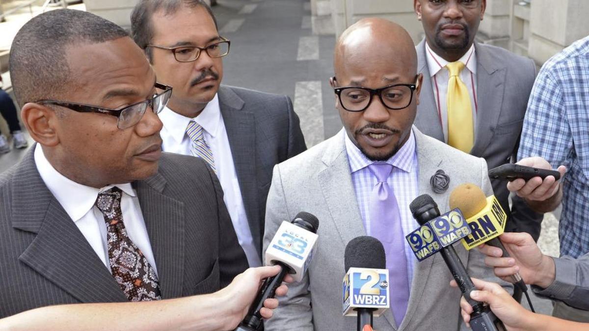 Mike Adams, from left, Brandon DeCuir, L. Chris Stewart and Dale Glover, attorneys for Alton Sterling's children, speak to the media after filing a wrongful death lawsuit in Baton Rouge, Louisiana on Tuesday, June 27, 2017.