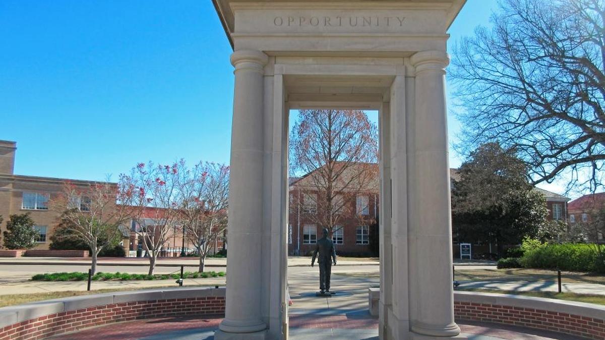 This March 12, 2017 photo shows a statue of James Meredith on the campus of the University of Mississippi in Oxford, Miss., walking through a structure engraved with the words opportunity, courage, perseverance and knowledge. Meredith was the first African-American student to enroll at the university and riots erupted on campus in 1962 over his enrollment.
