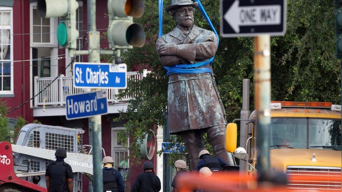 A statue of Confederate General Robert E. Lee is lowered to a truck for removal Friday, May 19, 2017, from Lee Circle in New Orleans. The city council voted to remove the monument and three other Confederate and white supremacist monuments in Dec. 2015. An obelisk honoring the militia known as the White League was taken down in April; a statue of Confederate President Jefferson Davis was removed May 11; and a statue of Confederate General P.G.T. Beauregard was taken down on Wednesday.