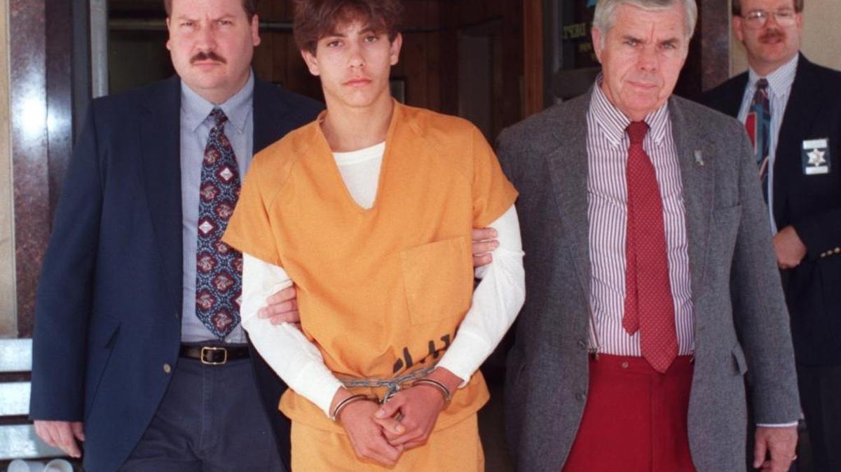 Stephen McGilberry, then 16, is escorted out of the Jackson County Sheriff’s office after his arrest in October 1994 on four counts of murder.