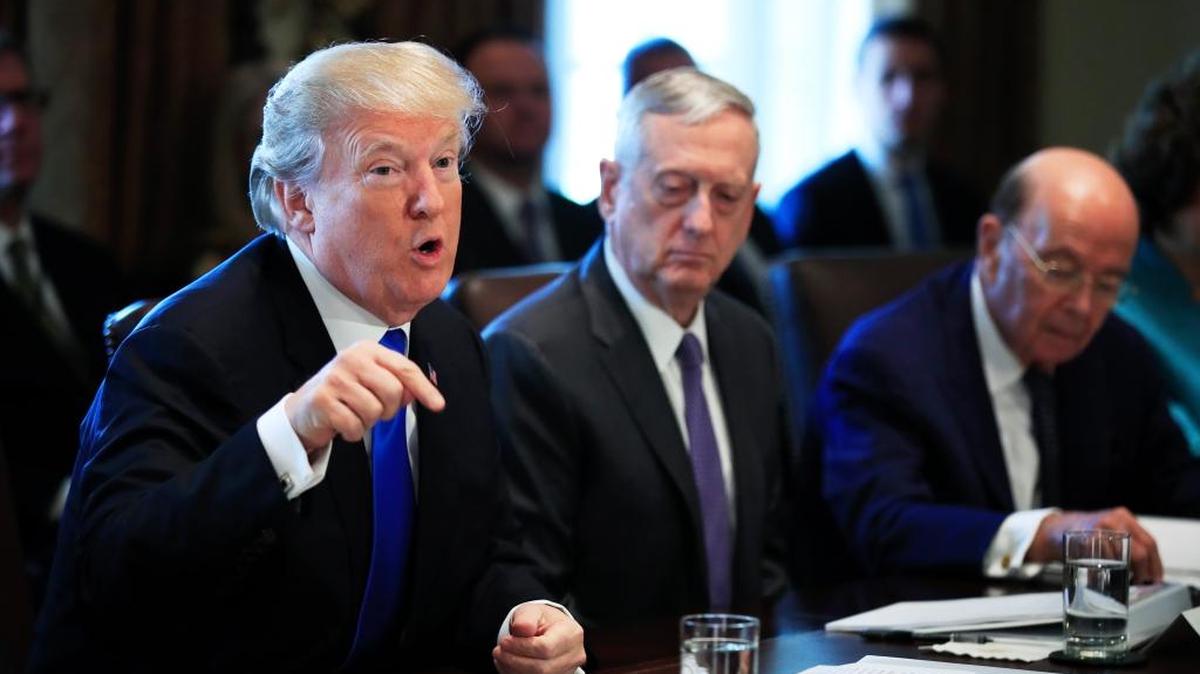 President Donald Trump, from left, with Secretary of Defense Jim Mattis and Secretary of Commerce Wilbur Ross, speaks during a cabinet meeting in the Cabinet Meeting Room of the White House in Washington, Wednesday, Dec. 6, 2017.