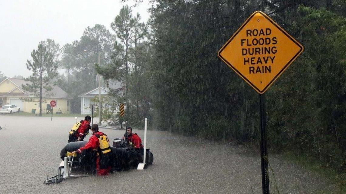 Members of the Gulfport Fire Deptartment swift water response team assisted the Harrison County Sheriff Department and the Harrison County Fire Service in evacuating people from their homes in the Oaklawn subdivision off Orange Grove Road in Harrison County on Sunday afternoon, Oct. 22, 2017. First responders across the Coast were kept busy with weather-related rescues, fires and accidents.