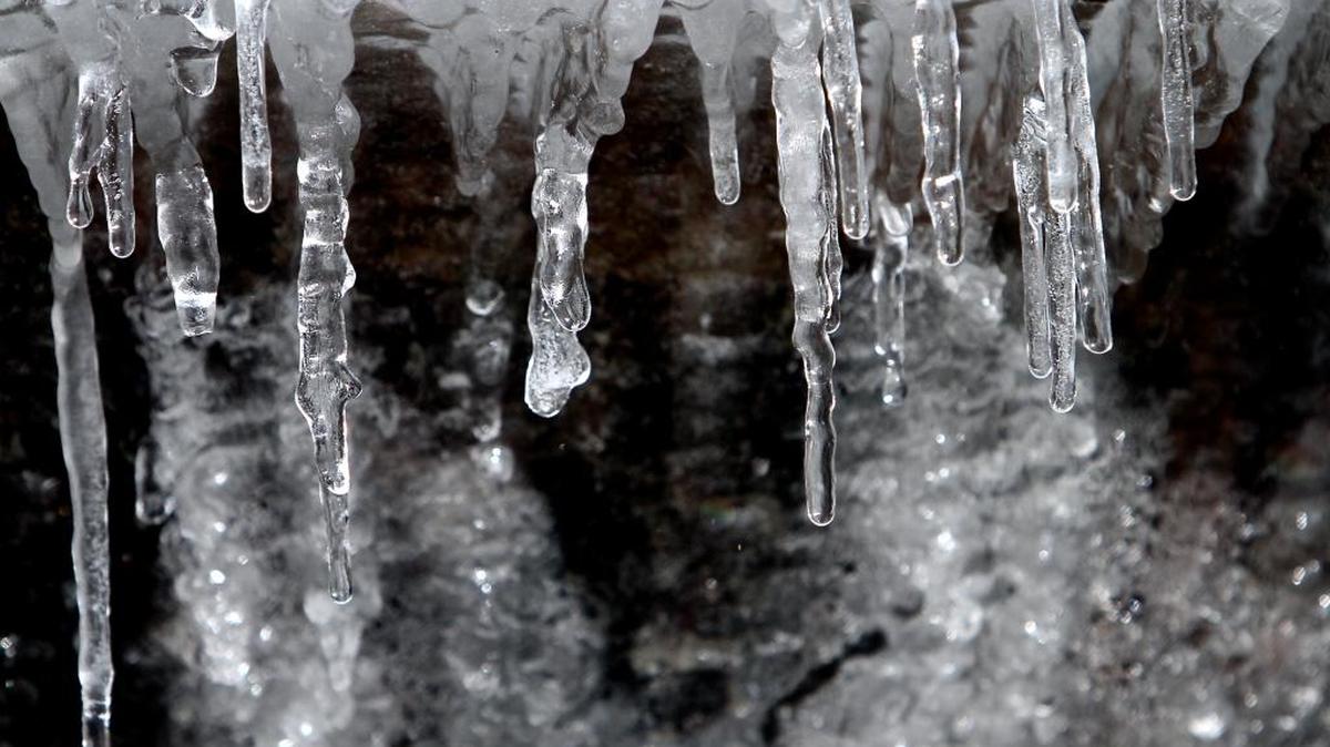 Icicles form around the edge of a fountain at the Columns at Gulfport in January 2010.