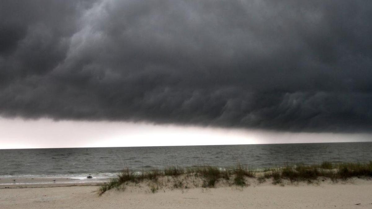 Dark clouds hover over Henderson Point during the early afternoon, Sunday, April 30, 2017.