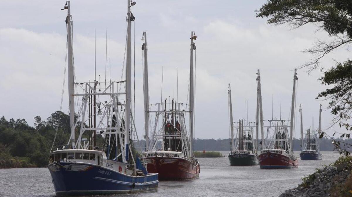 Shrimp boats make their way into the industrial canal and Gulfport for safe harbor during hurricane Nate