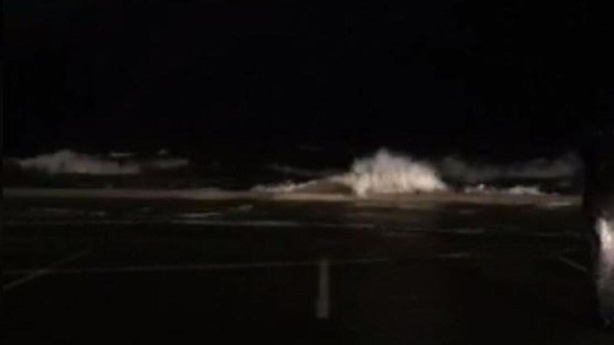 Waves crash ashore on U.S. 90 in Gulfport during Hurricane Nate