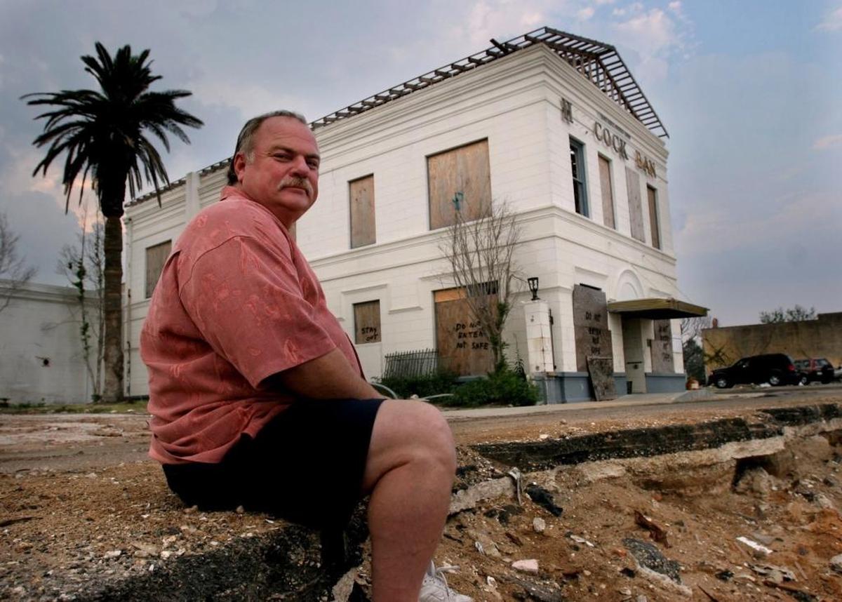 Eddie Favre, then mayor of Bay St. Louis, sits in the devastated downtown area after Hurricane Katrina. The Bay has since come back strong and Favre, who swore to wear shorts until recovery was complete, is working as Hancock County administrator.