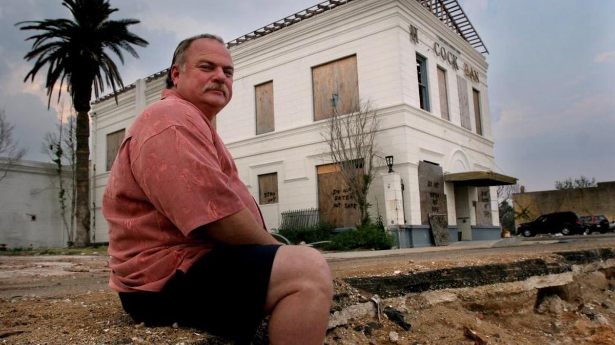 Eddie Favre, then mayor of Bay St. Louis, sits in the devastated downtown area after Hurricane Katrina. The Bay has since come back strong and Favre, who swore to wear shorts until recovery was complete, is working as Hancock County administrator. Patience, he said, is what southeast Texans need because recovery will take years.