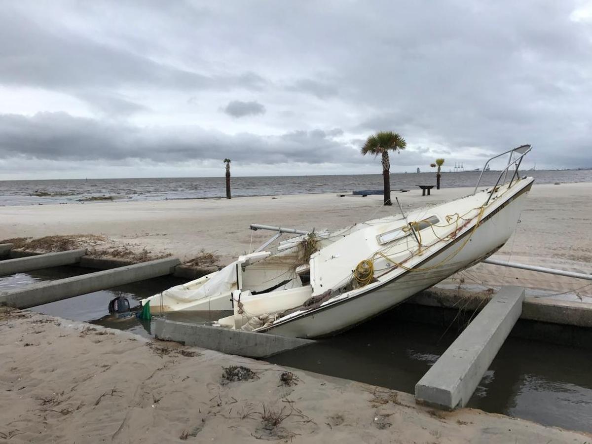 This boat washed ashore in Gulfport near the Courthouse Road pier. Crews were assessing damages from Hurricane Nate on Sunday in South Mississippi.