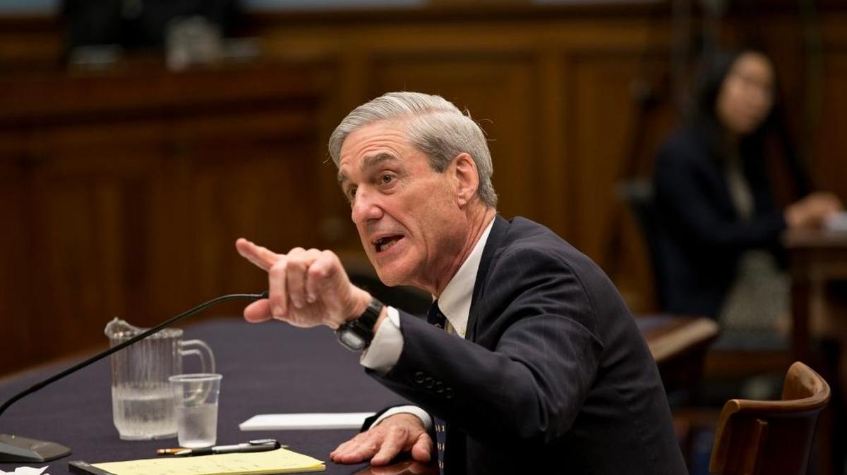 In this June 13, 2013 file photo, then-FBI Director Robert Mueller testifies on Capitol Hill in Washington. President Donald Trump’s closest allies are attacking the integrity of those involved in the widening probe of Russian interference in the U.S. election, accusing special counsel Mueller of driving a biased investigation. And Trump himself took aim at the senior Justice Department official responsible for appointing Mueller, accusing him on Twitter of leading a “Witch Hunt.”