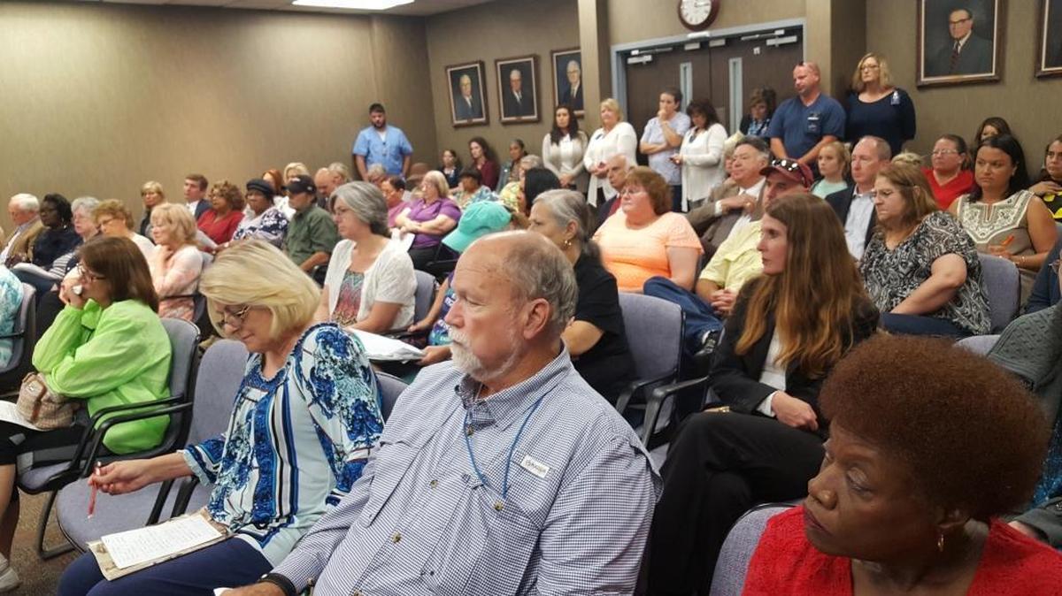 A crowd of retirees and patients of ousted Dr. Terry Millette and other interested, wait to speak to the Singing River Health System Board of Trustees.