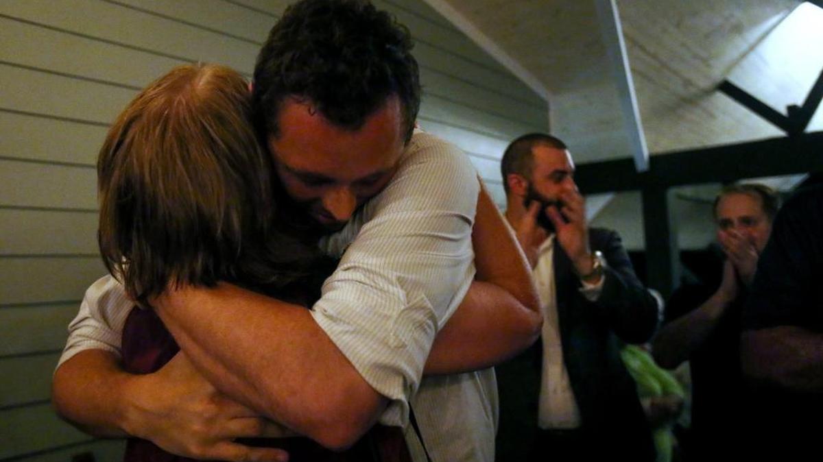Shea Dobson hugs his mother, Mary Debell, after winning the election to be the next Ocean Springs mayor on Tuesday.