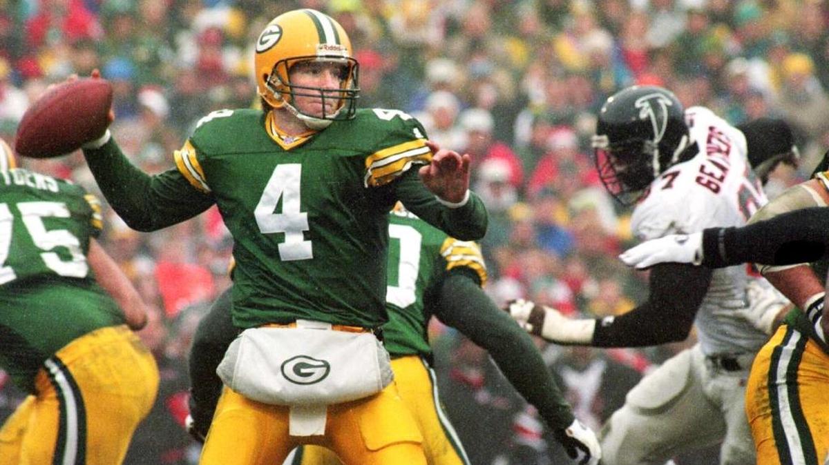 Brett Favre prepares to fire a pass against the Atlanta Falcons during first round of the NFC playoffs at Lambeau Field on Dec. 31, 1995.