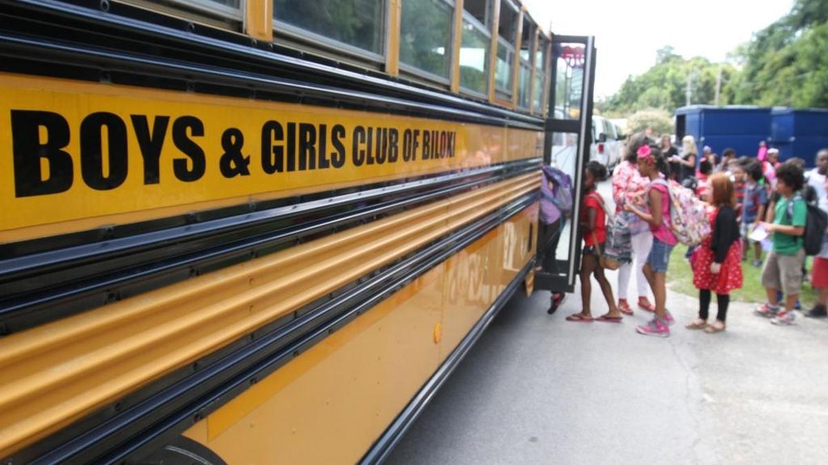 Popp’s Ferry Elementary School students in Biloxi hop on the Boys & Girls Clubs IP Center bus Wednesday. Several Boys & Girls Clubs of the Gulf Coast no longer provide after-school transportation from area schools because of budget cuts.