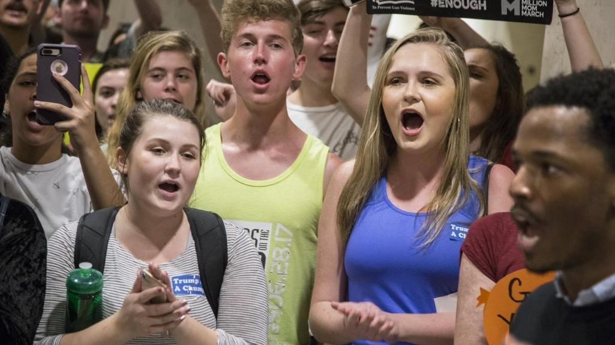 Students chant protest slogans outside the Florida House of Representatives chamber inside the Florida Capitol in Tallahassee, Fla. on Wednesday.
