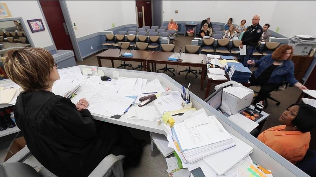 Harrison County Youth Court judge Margaret Alfonso, left, court employees and Department of Human Services workers prepare for court on Tuesday, May 17, 2016 in Gulfport. Two state legislators are looking at ways to reform the state's child welfare system in the wake of a series of stories on the topic by the Sun Herald.