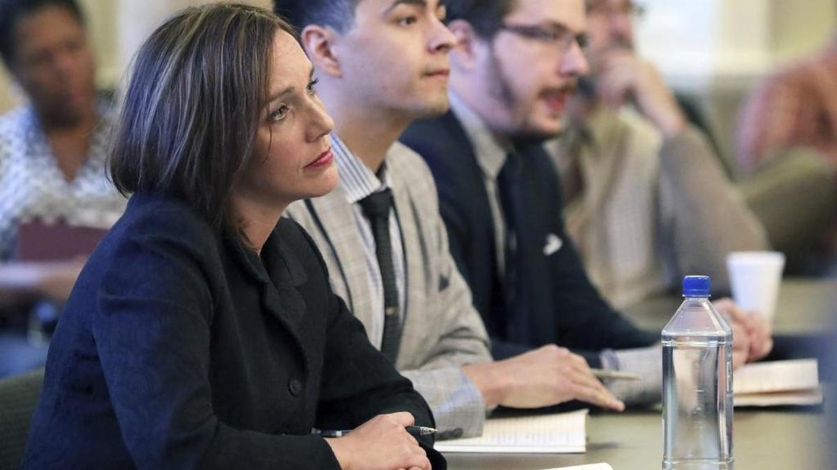 Rebecca Sibilia, CEO of EdBuild, a New Jersey nonprofit hired by legislative committees to make recommendations on policies of Mississippi’s education-funding formula, and her associates listen to a speaker during a public comment forum at the Capitol in Jackson in November. Back then, she’d planned to have her report done by November.