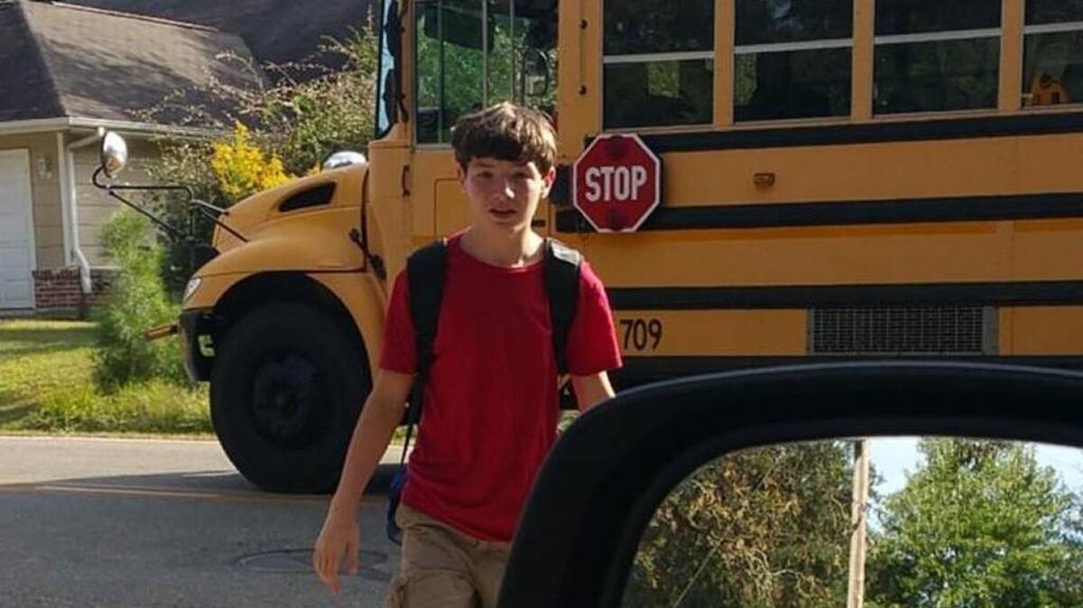 Sheree Abbott snapped this photo last year of her son getting off a hot school bus. The driver of the Hancock Middle School bus does not allow students to open their windows, Abbott said, as shown in the photo. The driver also has a fan near her seat.