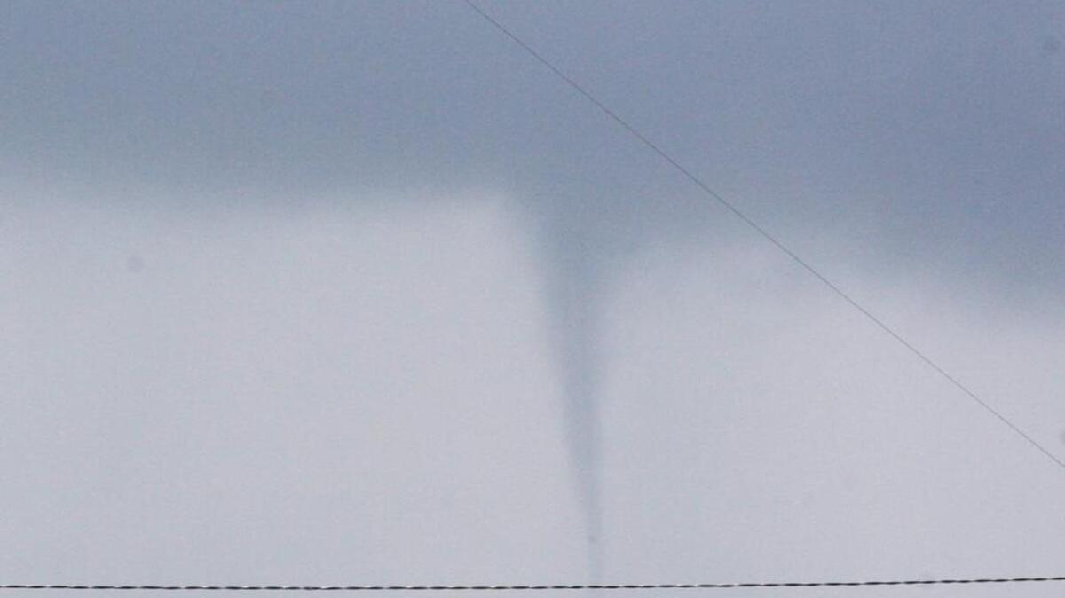 If you spot a tornado or waterspout, such as seen in this file photo of a waterspout near Biloxi, take immediate shelter.