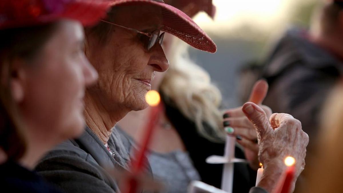 Mary Lucas, who was a passenger on the charter bus that was struck by a CSX freight train, attends a vigil on March 12 at Doris L. Busch Park in Biloxi for the victims who died in the crash. Lucas was one of the first to exit the bus when it became stalled and wanted to honor her friend, Debbie Orr, who was killed.